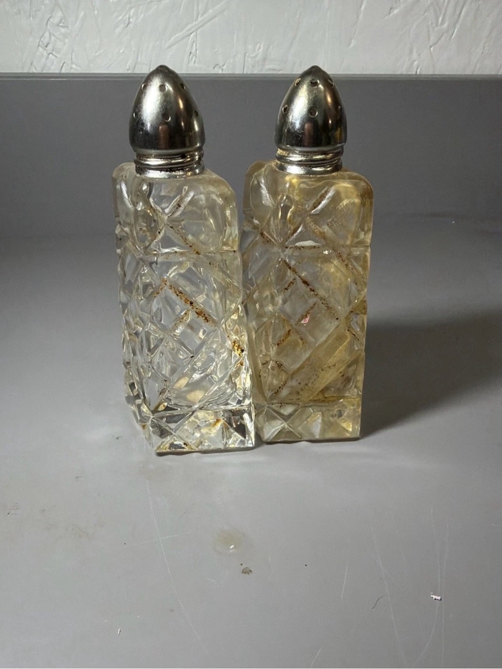 Clear Cut-Glass Salt and Pepper Shakers with Silver Tops